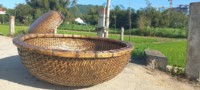 Bateau coracle vietnamien traditionnel en bambou - Panier de pêche artisanal et écologique