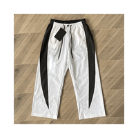 Ensemble de survêtement coupe-vent de haute qualité Ensemble coupe-vent d'été décontracté avec logo personnalisé Survêtement en nylon pour homme Ensemble court coupe-vent