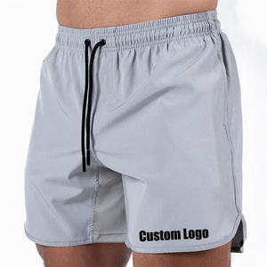 Pantalones cortos de entrenamiento para correr de compresión con logotipo personalizado Pantalones deportivos de gimnasio de secado rápido para hombres High Street Style Servicio OEM sólido disponible - Product Image 1