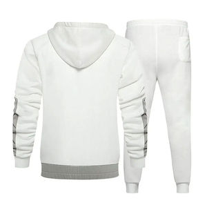 El producto es un chándal de dos piezas unisex o para hombre en color blanco con un diseño moderno y funcional. - Product Image 2