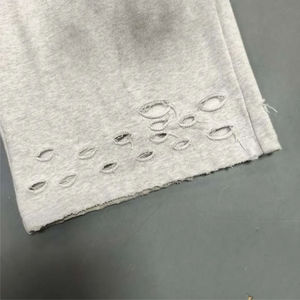 กางเกงจ็อกเกอร์ทรงหลวมขาบานสไตล์วินเทจ ผ้าฝรั่งเศสเทอร์รี่คอตตอนคุณภาพสูง ล้างสีแบบแอซิด แต่งคริสตัล ดีไซน์ขาดๆ - Product Image 3