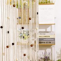 Rideaux bohèmes en macramé faits à la main pour fenêtres du salon avec un design de corde en coton naturel et un style de décoration d'intérieur vintage