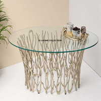Table basse décorative pour la maison en métal de style floral et feuillu avec cadre doré et plateau en verre rond