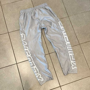 Pantalons de survêtement unisexes avec logo personnalisé, bandes réfléchissantes en nylon, style baggy, coupe-vent, pantalon de survêtement, taille plus, jambe large - Product Image 5