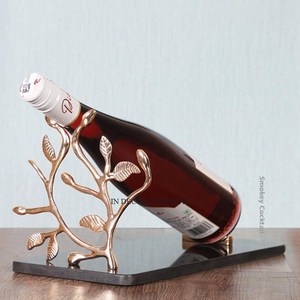 Most Selling High Grade Gold Plated Aluminum Casted Leaves Designer Wine Bottle Stand Holder Decorative With Black Color Base - Product Image 1