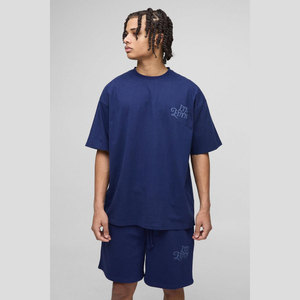 ชุดกางเกงขาสั้นและเสื้อยืดสำหรับผู้ชายชุดผ้าคอตตอน100% พิมพ์ลายพัฟโลโก้โอเวอร์ไซส์สำหรับผู้ชาย - Product Image 1