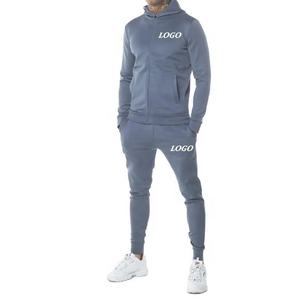 Venta al por mayor 100% conjuntos de Jogger de algodón para los hombres con logotipo personalizado bordado sudaderas con capucha y pantalones de chándal elegantes pantalones de correr de invierno - Product Image 1