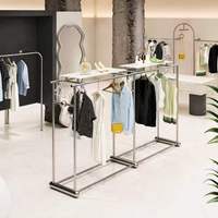 Présentoir à vêtements moderne en acier inoxydable, double rangée, étagère îlot pour rangement de sacs, aménagement personnalisé pour magasins de détail