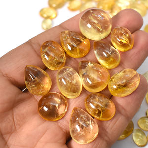 พลอยซิทรินธรรมชาติ คละขนาดและรูปทรง แบบคาโบชอง ขายส่ง ล็อต 635 กะรัต 87 ชิ้น - Product Image 4