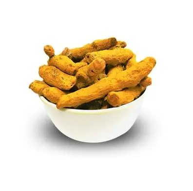 Fette di curcuma essiccate e dito di curcumina