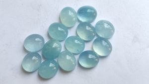 Haute qualité laiteux aigue-marine bleu naturel semi-précieux ovale coupe 6X8mm dos plat Cabochon fabrication de bijoux pierres en gros - Product Image 3