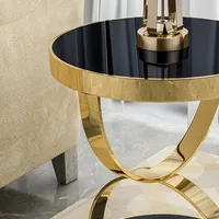 Table basse en fer de forme ronde au design antique, finition dorée, plateau en verre, table basse tendance pour la maison.