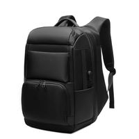 Mochilas universitarias unisex con logotipo personalizado, mochila impermeable negra de moda suave caliente con forro de cuero genuino y cierre de cremallera