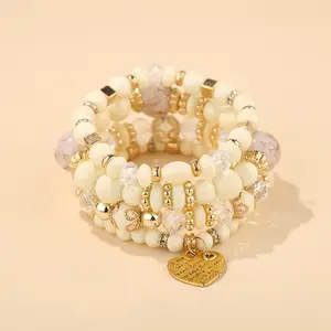 Best-seller Vente en gros de bracelets multicouches de style ethnique bohème avec perles cœur en cristal Bijoux pour femmes à la main