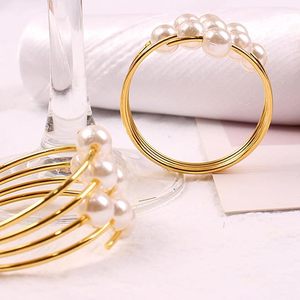 Boucles d'anneaux de serviette en acier inoxydable délicates Banquets de perles Vacances Mariages Fêtes du Nouvel An Décorations de table en papier de bois - Product Image 3