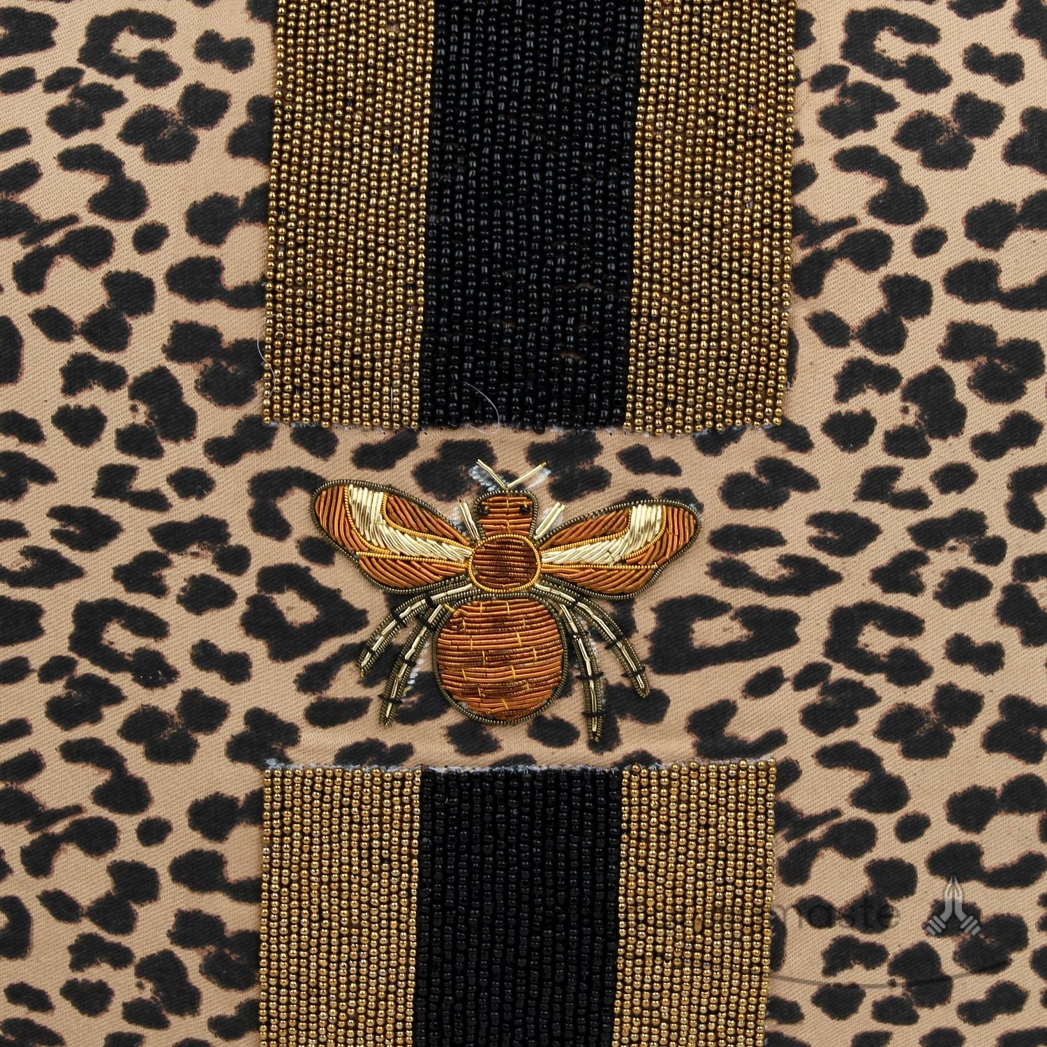 Leopard print with black, brown & orange motifs