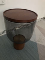 Table basse moderne convertible 2026 avec structure en fer et plateau en verre trempé, idéale pour salon et salle à manger