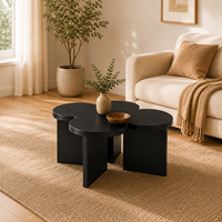 Table basse moderne écologique en forme de trèfle noir avec finition grain de bois pour salon et mobilier de maison