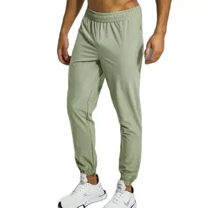 Pantaloni da jogging sportivi da uomo con cerniera personalizzata in tinta unita di vendita calda all'ingrosso con tasca