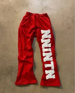 Pantalones acampanados con parches desgastados personalizados OEM, pantalones de chándal para correr Unisex, pantalones de chándal apilados acampanados con lavado ácido de lana de algodón para hombres - Product Image 2