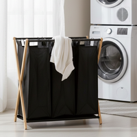Panier à linge double pliable minimaliste avec cadre métallique en toile noire pour organiser les vêtements, à utiliser dans la cuisine ou la salle de bain