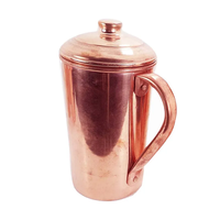 Carafe en cuivre de grande capacité au design moderne, faite à la main, avec logo personnalisé, pour des habitudes de consommation d'eau saines et un bien-être durable.