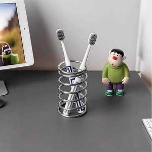 Porte-brosse à dents en métal décoratif avec un design moderne pour l'affichage sur le comptoir de la salle de bain - Product Image 1