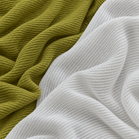 Tissu en maille respirante, léger et texturé, fabriqué directement en usine, disponible en plusieurs couleurs pour vêtements de sport, t-shirts et autres articles vestimentaires.
