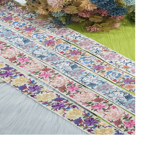 Hecho a medida en tela de base blanca, cordones bordados a máquina en diseños florales y en opciones multicolores para vestidos de novia. - Product Image 1