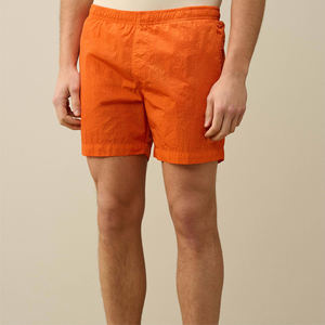 Pantalones cortos de playa sólidos de poliéster 100% naranja brillante personalizados, bañadores de verano ligeros de secado rápido para hombre, cintura elástica con cordón - Product Image 2