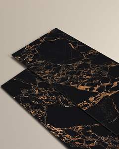 Dalle en porcelaine haute brillance Erica Black Beauty avec veines dorées pour la décoration murale intérieure dans les appartements et les villas - Product Image 1