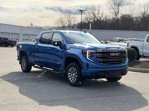 Super Blue 2024 GMC Sierra 1500 AT4 Crew Cab 4WD Techo Panorámico Arranque Remoto Asientos de Cuero Paquete Premium Cromado Izquierdo Oscuro - Product Image 2