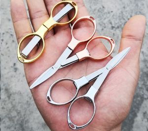 Pequeñas tijeras plegables Mini tijeras portátiles Herramienta de corte de viaje elástica de acero inoxidable de Mahersi - Product Image 1