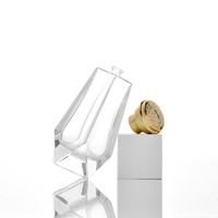 Flacons de parfum en verre transparent personnalisés avec base facettée et capuchon brillant 100 ml pour marques, disponibles en gros en stock