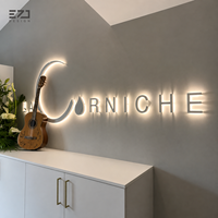 Enseigne murale lumineuse LED 3D personnalisée en métal doré rétroéclairé EZD pour la publicité des salons de beauté, spas, studios et devantures de magasins