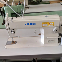 Machine à coudre industrielle à point droit simple aiguille JUKI DDL-5550N d'occasion pour vêtements