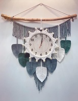 Horloge murale bohème faite à la main avec un design en macramé en tissu tressé pour la décoration de la maison, motif nature morte suspendu