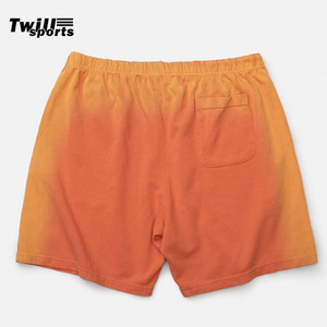 Shorts de bain pour hommes OEM personnalisés en toile camouflage, effet délavé, écologiques, jaune-orange, style urbain, ambiance estivale, vente en gros - Product Image 2