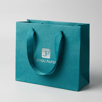 Bolsa de Regalo Grande de Papel de Arte de Buena Calidad con Logotipo Personalizado, Estampado Dorado y Asa de Cuerda Dorada para Empaque de Ropa, Directo de Fábrica