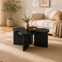Table basse moderne écologique en forme de trèfle noir avec finition grain de bois pour salon et mobilier de maison