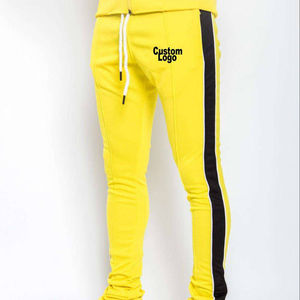 Color amarillo sólido y estilo de tira negra lateral para hombres con su propio logotipo Pantalones apilados para hombres - Product Image 1