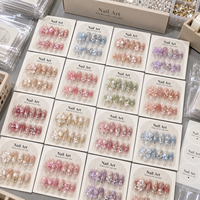 Kuku Palsu Pastel Jelly Grosir Buatan Tangan 3D Bunga Kristal Almond Dapat Digunakan Kembali Set Kuku Kustom Pemasok Pabrik OEM
