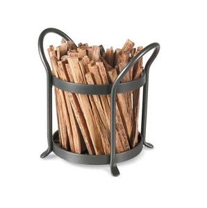 Decorative wrought iron log rack for holding and displaying split logs beside a modern wood burning <b>stove</b> indoors - Product Image 2