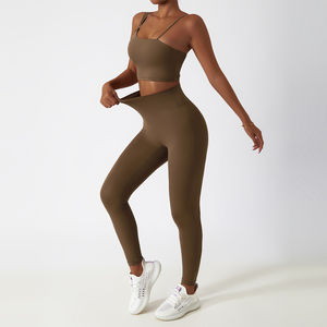 Conjunto de Yoga de alta calidad para mujer, mallas deportivas sin costuras con logotipo personalizado y sujetador, Top liso de compresión con patrón sólido - Product Image 2