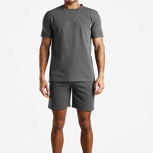 Conjunto corto de ropa de verano de secado rápido para hombres y con logotipo personalizado Patrón sólido 100% Chándales de algodón - Product Image 3