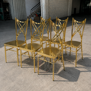Crossed <b>Ribbon</b> Back Gold Stainless Steel Wedding Chair with White Cushion for Wedding and Banquet Events Event Seating - Product Image 1