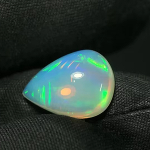 Mehrajudin <b>Gems</b> AA High Quality 4.75 CT Ethiopian Natural White Pear-Shape Cabochon Opal <b>Stone</b> with Multi Flashy <b>Fire</b> - Product Image 1
