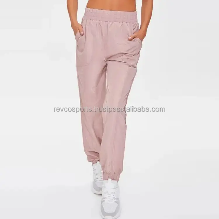 Kadın spor elastik bel Sweatpants kadınlar için yan cepler ile atletik eşofman altları 100% Polyester spor salonu açık pembe joggers