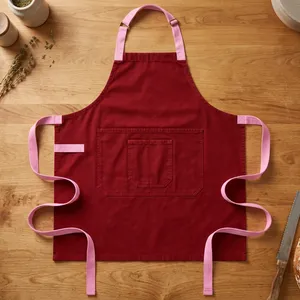 Delantal Clásico Rojo de Lona con Ribete Rosa y Bolsillo Frontal, Reutilizable y Resistente al Agua para Cocinar - Product Image 1