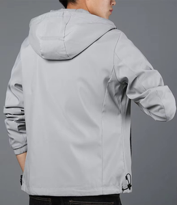 Chaqueta cortavientos de lona transpirable con logotipo personalizado para hombre y mujer, chaqueta de lluvia con capucha de retazos para exteriores con cremallera completa, teñida lisa - Product Image 1